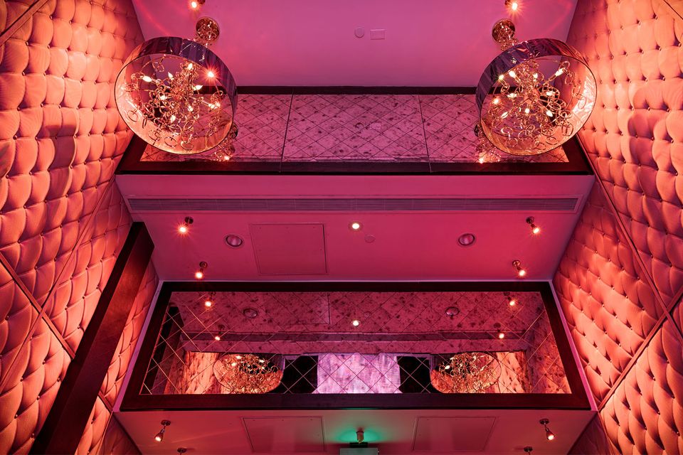 E11even Miami ultra club interior — neon stage lighting and theatrical bar